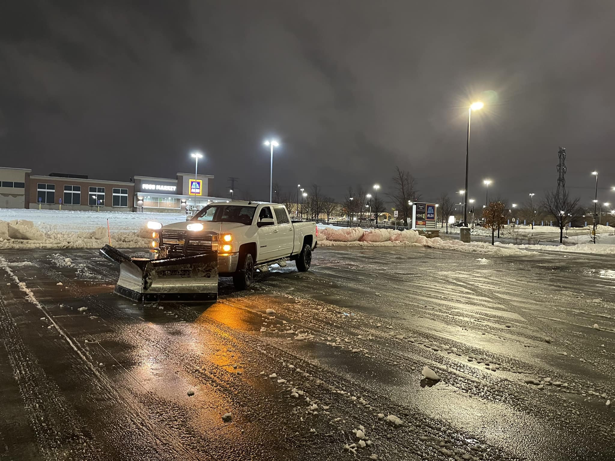 Commercial snow plowing in Chisago County Minnesota parking lot by Hambly Lawn Service